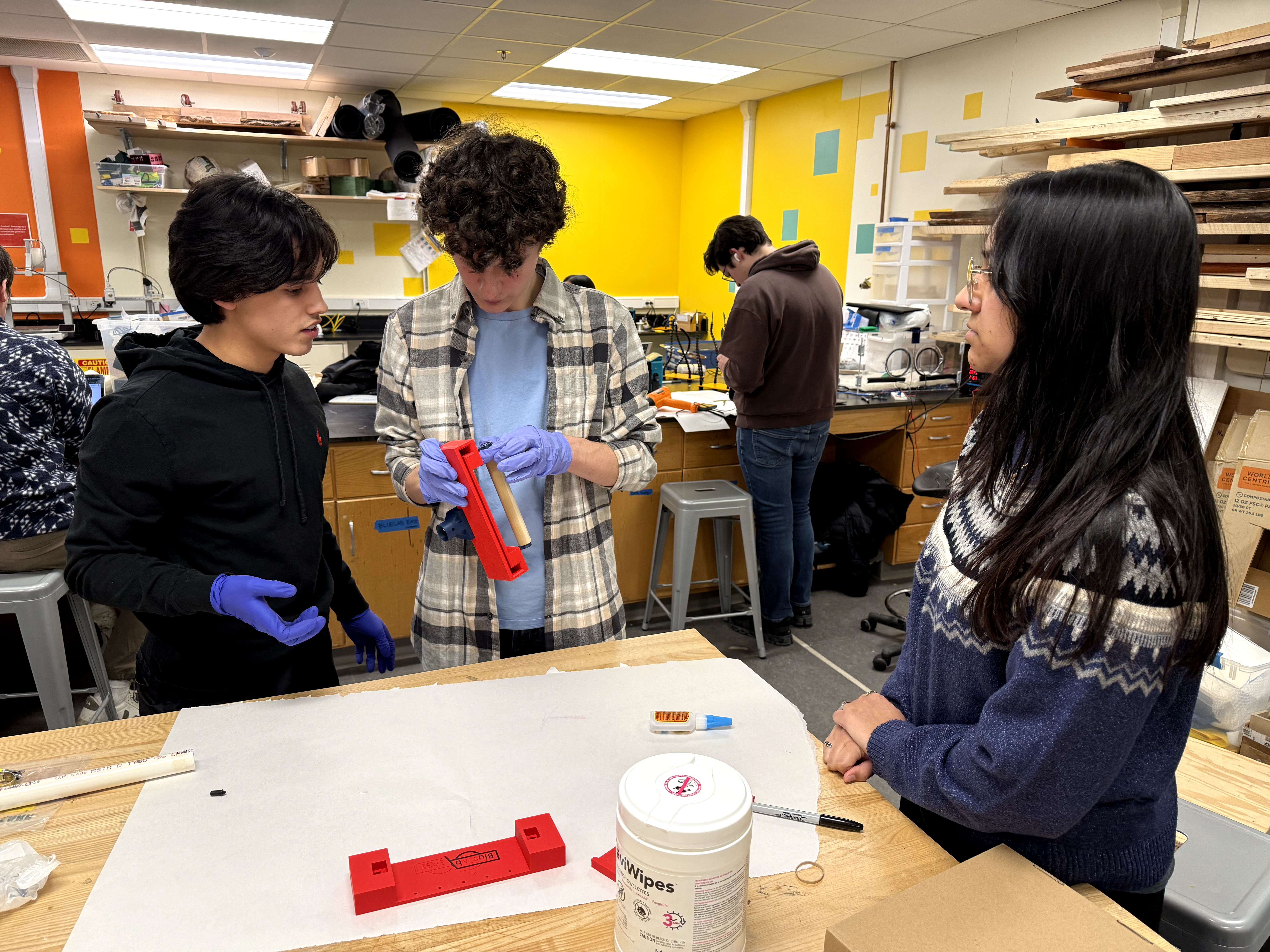 BLUElab EASE Ann Arbor team working together on the spring handle clamp prototype