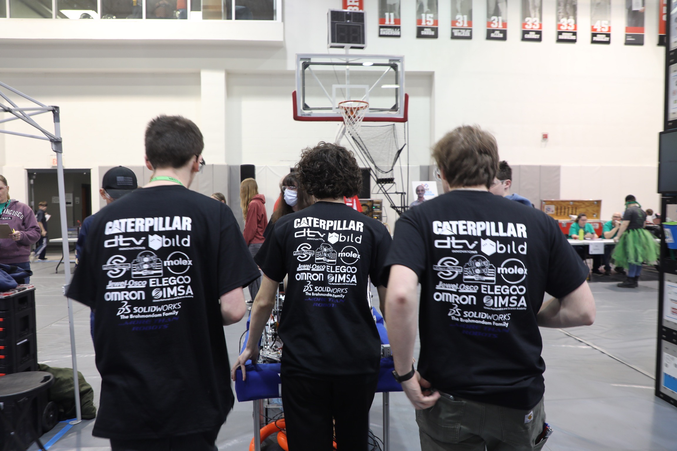 Nathan and teammates pushing the robot cart to a match